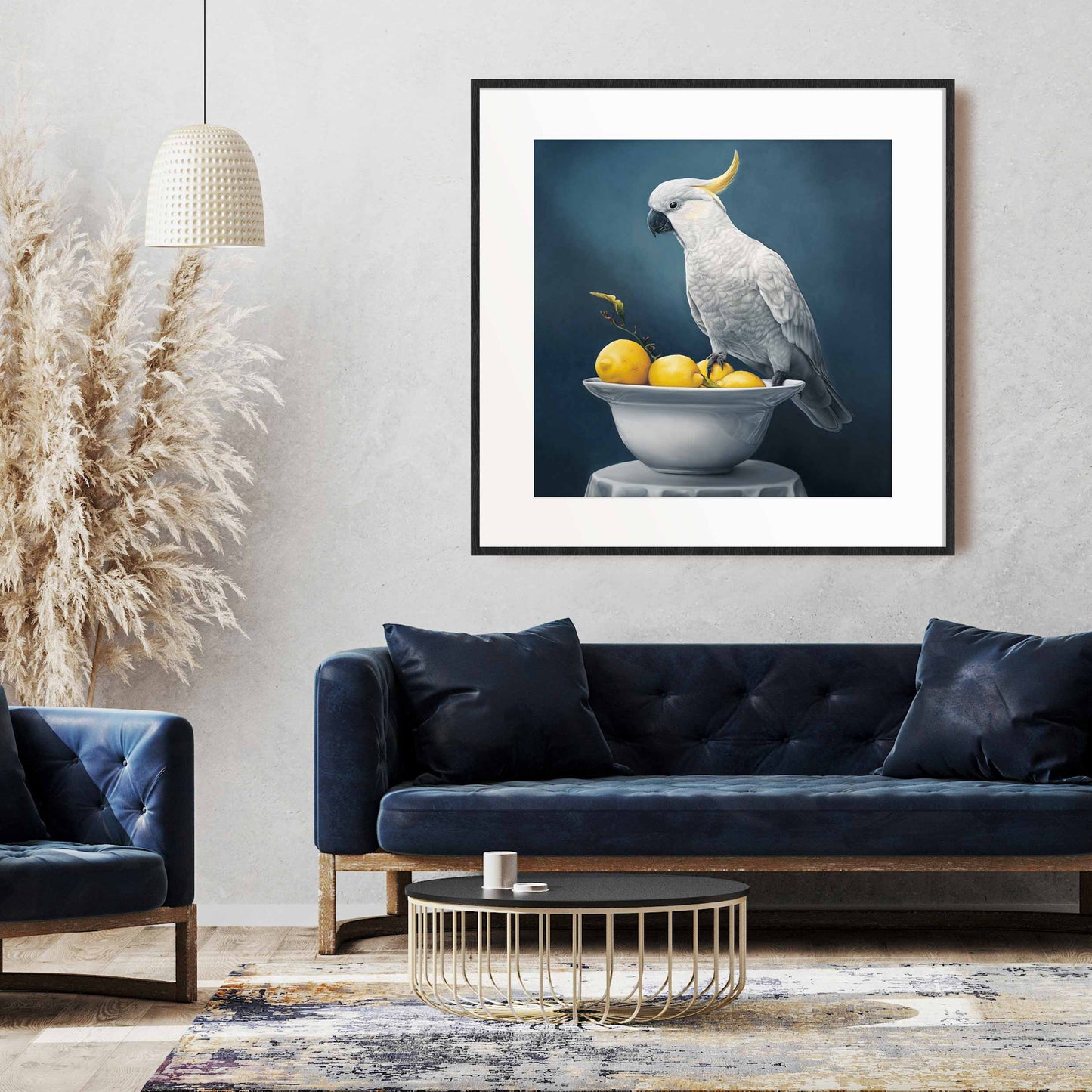 Framed artwork in home of a white cockatoo sitting on a bowl of lemons